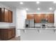 Kitchen boasts granite countertops and wood cabinets at 3482 Forster Ave, Leesburg, FL 34748