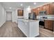 Open concept kitchen with stainless steel appliances and island at 3482 Forster Ave, Leesburg, FL 34748