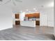Open concept kitchen with island and stainless steel appliances at 3482 Forster Ave, Leesburg, FL 34748