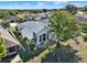Aerial view showing the house with a serene backyard in a neighborhood close to the golf course at 5024 St Andrews Arc, Leesburg, FL 34748