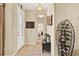 Inviting entryway featuring tile floors, a decorative wine rack and views into the bedroom beyond at 5024 St Andrews Arc, Leesburg, FL 34748
