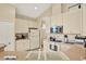 Functional kitchen with plenty of cabinet space, modern appliances and a view of adjacent rooms at 5024 St Andrews Arc, Leesburg, FL 34748