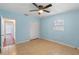 Bedroom with light blue walls, tiled floors, and a ceiling fan at 514 S Crystal Lake Dr, Orlando, FL 32803