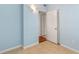 Light blue bedroom with tile floors and closet at 514 S Crystal Lake Dr, Orlando, FL 32803