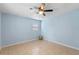 Light blue bedroom with tiled floors and ceiling fan at 514 S Crystal Lake Dr, Orlando, FL 32803