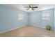 Light blue bedroom with tiled floors and ceiling fan at 514 S Crystal Lake Dr, Orlando, FL 32803