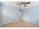 Light blue bedroom with tiled floors and ceiling fan at 514 S Crystal Lake Dr, Orlando, FL 32803