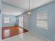 Light and airy dining area with hardwood floors and light blue walls at 514 S Crystal Lake Dr, Orlando, FL 32803