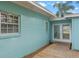 Home's exterior with light blue walls and wooden deck at 514 S Crystal Lake Dr, Orlando, FL 32803