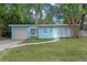 Light blue house with a beige garage and well-manicured lawn at 514 S Crystal Lake Dr, Orlando, FL 32803