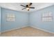 Hallway connecting bedrooms with light blue walls at 514 S Crystal Lake Dr, Orlando, FL 32803
