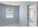 Bright kitchen with white tile floors and light blue walls at 514 S Crystal Lake Dr, Orlando, FL 32803
