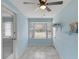 Sunroom with bay window, ceiling fan and built-in shelving at 514 S Crystal Lake Dr, Orlando, FL 32803