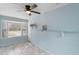 Sunroom with bay window, ceiling fan and built-in shelving at 514 S Crystal Lake Dr, Orlando, FL 32803