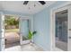 Sunroom with French doors opening to backyard and access to kitchen at 514 S Crystal Lake Dr, Orlando, FL 32803