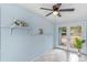 Sunroom with ceiling fan, French doors and built-in shelving at 514 S Crystal Lake Dr, Orlando, FL 32803