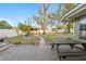 Spacious backyard features a fire pit and seating area at 5607 Huber Dr, Orlando, FL 32818