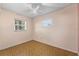 This bedroom features two windows and a ceiling fan at 5607 Huber Dr, Orlando, FL 32818