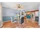 Sunlit dining area with contemporary furnishings, seamlessly connecting to the kitchen and living spaces, perfect for modern living at 5607 Huber Dr, Orlando, FL 32818