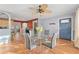 Bright dining area with a glass table, modern chairs, and an open view into the kitchen, creating an inviting and functional space at 5607 Huber Dr, Orlando, FL 32818