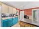Well-lit kitchen with a breakfast bar, modern appliances, and ample cabinet space, designed for efficient meal preparation and storage at 5607 Huber Dr, Orlando, FL 32818