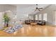 Spacious living room with hardwood floors, vaulted ceilings, and ample natural light, providing a comfortable and inviting atmosphere at 5607 Huber Dr, Orlando, FL 32818