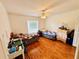 Spacious bedroom with wood flooring and a ceiling fan at 567 Rachael Court, Oviedo, FL 32765