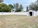 Fenced backyard with storage shed at 5861 Windridge Dr, Winter Haven, FL 33881