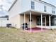 Backyard with screened patio and grill at 5861 Windridge Dr, Winter Haven, FL 33881