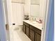 Bathroom with double sinks and shower/tub combo at 5861 Windridge Dr, Winter Haven, FL 33881