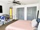 Bedroom with king-size bed and large closets at 5861 Windridge Dr, Winter Haven, FL 33881