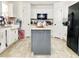 Spacious kitchen with island and stainless steel appliances at 5861 Windridge Dr, Winter Haven, FL 33881