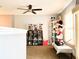 Upper level landing with display cases and collectibles at 5861 Windridge Dr, Winter Haven, FL 33881