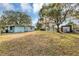 Backyard with shed and large trees at 637 19Th St, Orlando, FL 32805