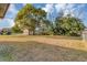 Large backyard with mature trees and chain link fence at 637 19Th St, Orlando, FL 32805