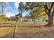 Backyard with mature trees, clothesline, and fence at 637 19Th St, Orlando, FL 32805
