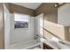 Bathroom with white tiled walls and bathtub at 637 19Th St, Orlando, FL 32805