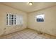 Simple bedroom with tile floors and two windows at 637 19Th St, Orlando, FL 32805