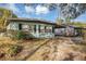 Ranch-style home with carport and mature landscaping at 637 19Th St, Orlando, FL 32805