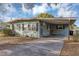 House with carport, mature trees, and a spacious yard at 637 19Th St, Orlando, FL 32805