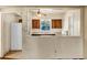 Kitchen with wood cabinets, sink, and stove at 637 19Th St, Orlando, FL 32805