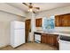 Galley kitchen with wood cabinets and appliances at 637 19Th St, Orlando, FL 32805