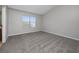 Well-lit bedroom with gray carpet and large window at 6416 S Goldenrod Rd # 8B, Orlando, FL 32822