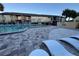 Relaxing pool area with lounge chairs and building view at 912 Lake Destiny Rd # G, Altamonte Springs, FL 32714