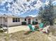Backyard area with fire pit, seating, and a patio at 930 Lewis Dr, Daytona Beach, FL 32117