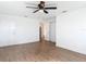Bedroom with hardwood floors, a ceiling fan, and closet space at 930 Lewis Dr, Daytona Beach, FL 32117