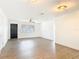 Open living room with a large window, hardwood floors, and an abundance of natural light at 930 Lewis Dr, Daytona Beach, FL 32117