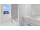 Elegant bathroom with marble tile and a soaking tub at 9847 Laurel Berry Dr, Orlando, FL 32827