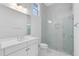 Modern bathroom with a walk-in shower and white vanity at 9847 Laurel Berry Dr, Orlando, FL 32827