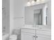 Clean bathroom with white vanity and marble accents at 9847 Laurel Berry Dr, Orlando, FL 32827
